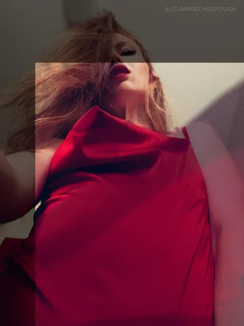 The up-angle view of my sensual body as I lean forward to subtly lift the hem of my holiday party gown…