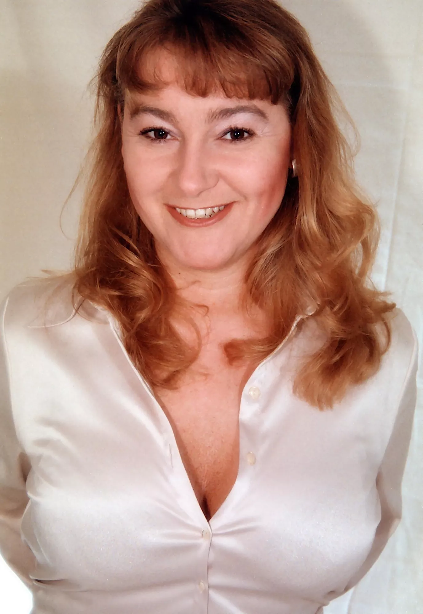 Tits squeezed into a tight Satin Blouse