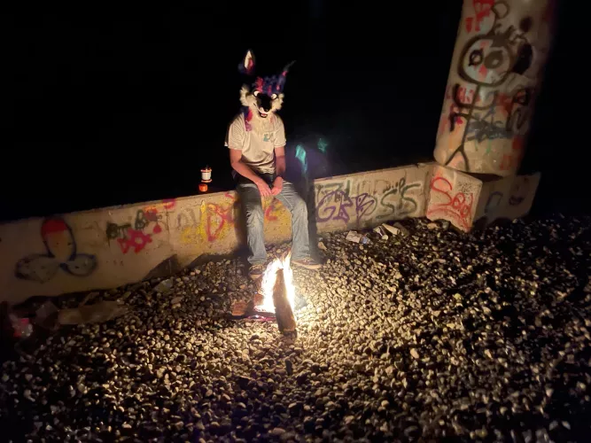 You look cold, traveler. Come, join me by the fire, and tell me about your journey.