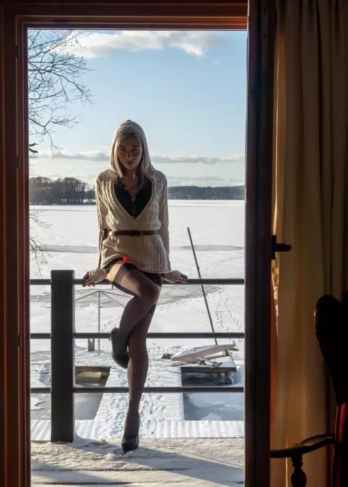Heels and stockings and snow and me in teasing pose. 🌶️