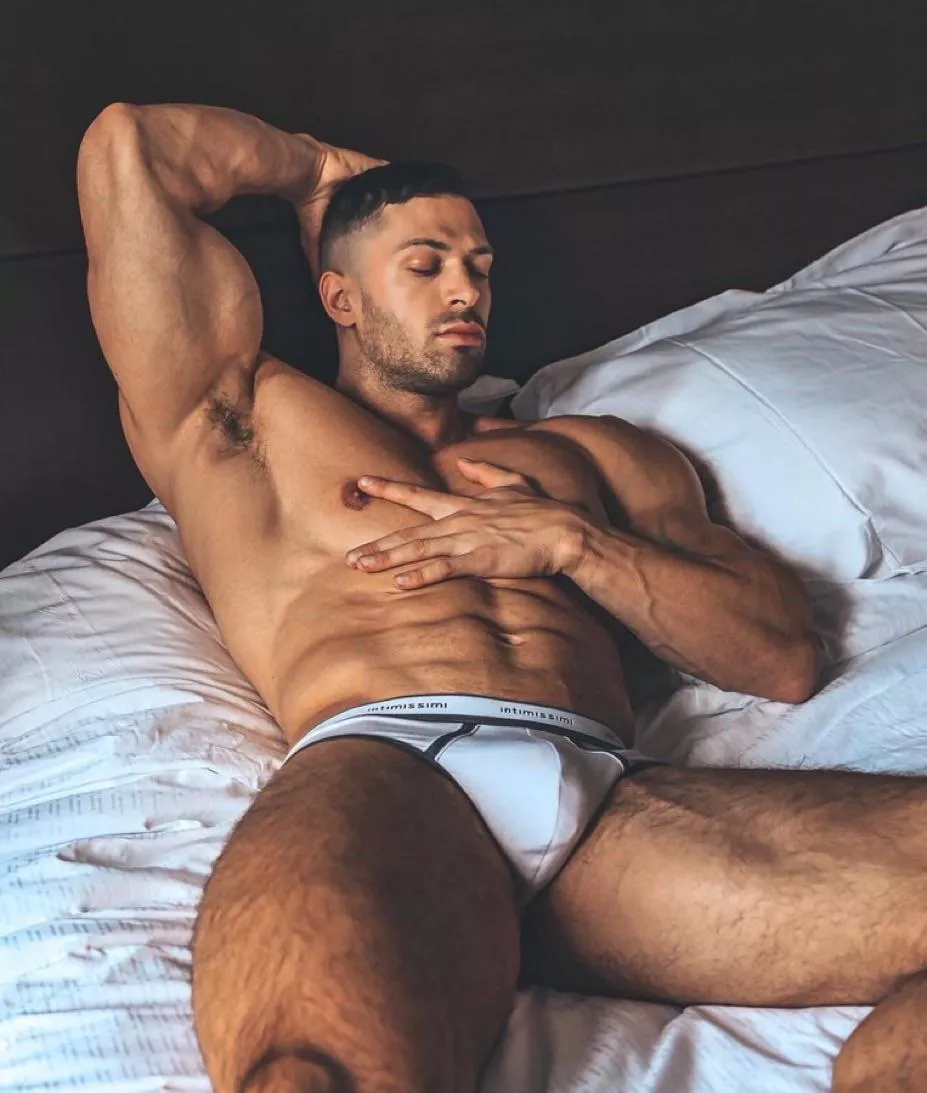 Hunk in bed