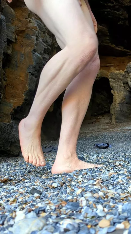Naked at a cave entrance...
