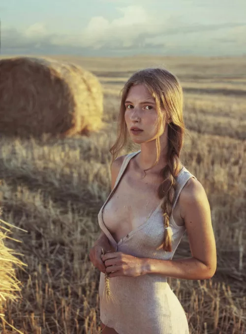 After a hot day at work, she ran far into the wheat fields. But the ears of wheat have already been mowed down and there is nowhere to retire.