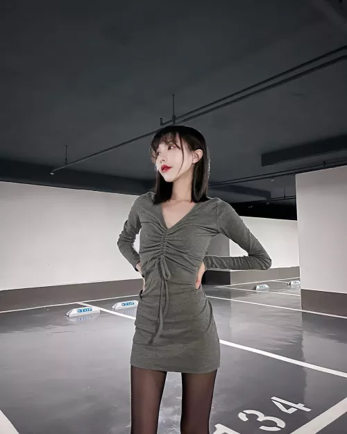 Cutie in a green dress and black tights