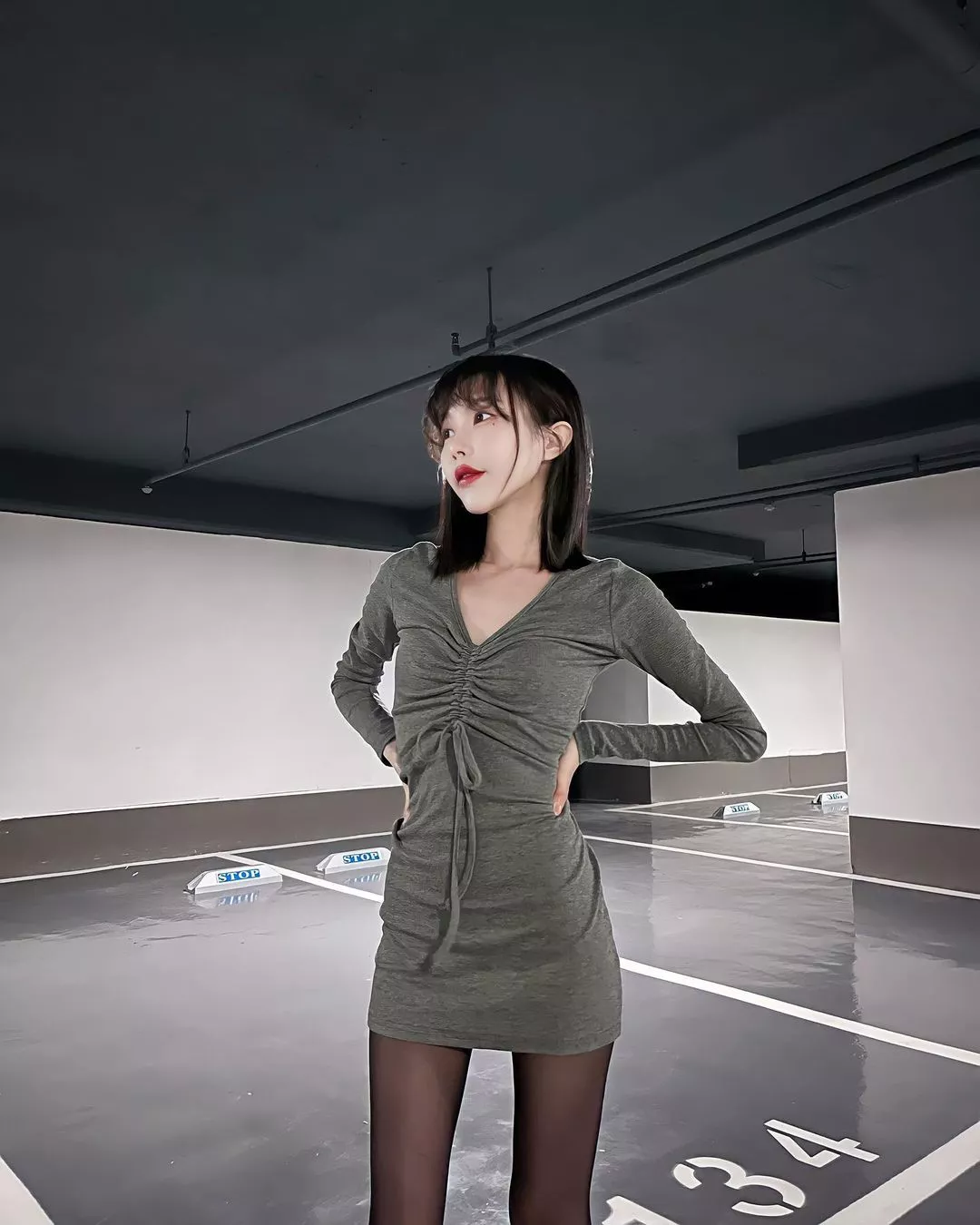 Cutie in a green dress and black tights