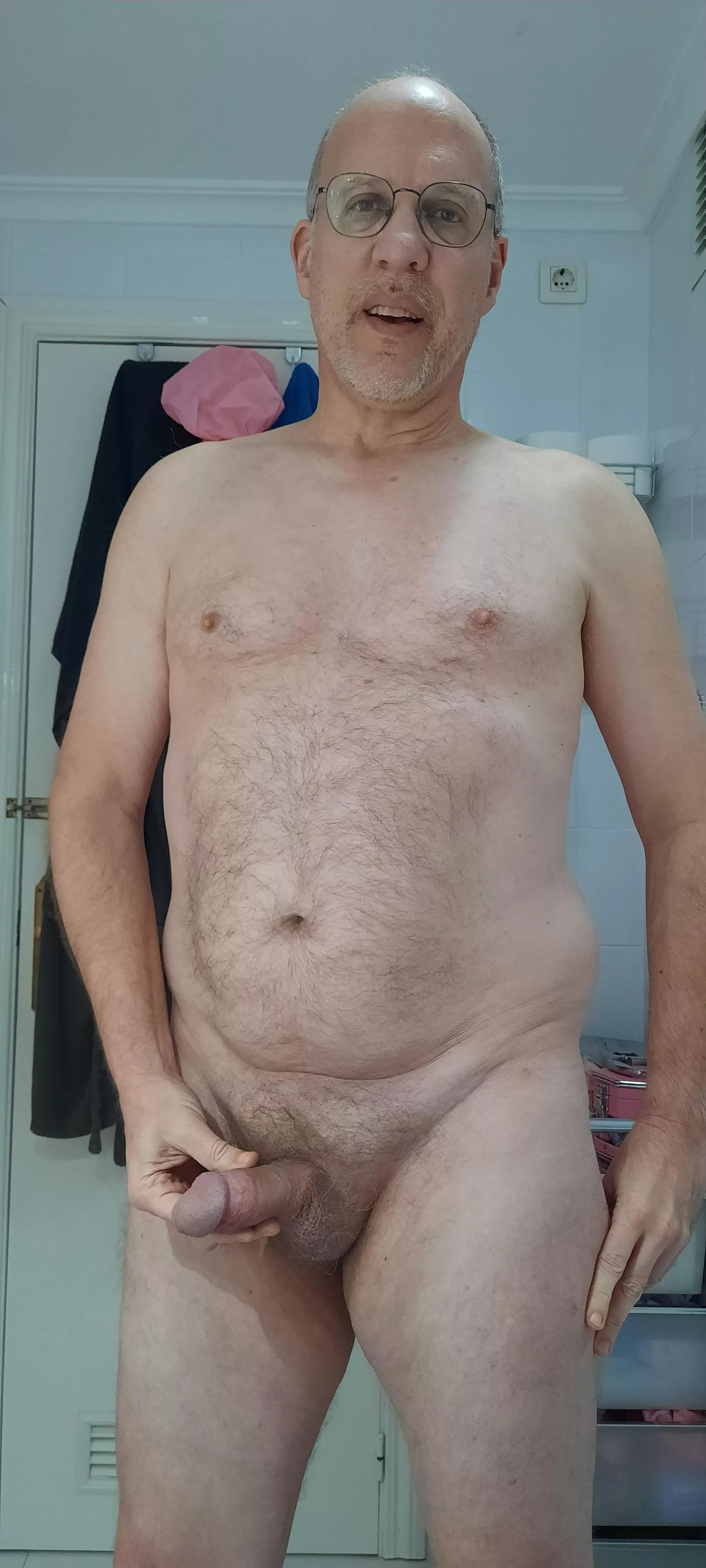 Holding my penis when it's soft. Should I start stroking it? (50)