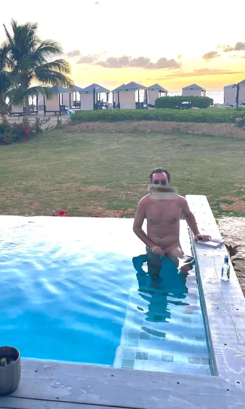 A little nude tanning in the resort plunge pool