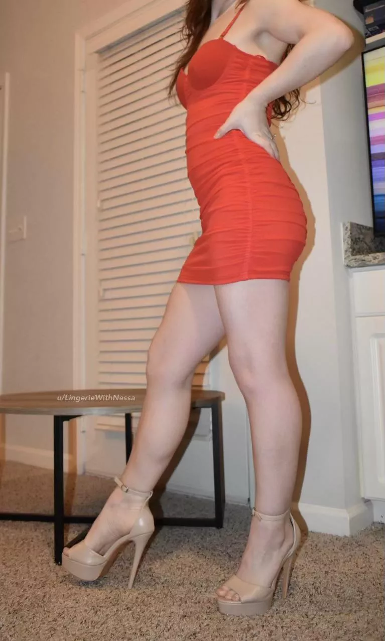 Nude platform heels and a tight red dress