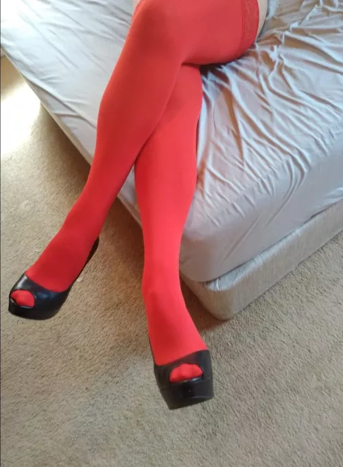 Red thigh highs and peep toe heels.