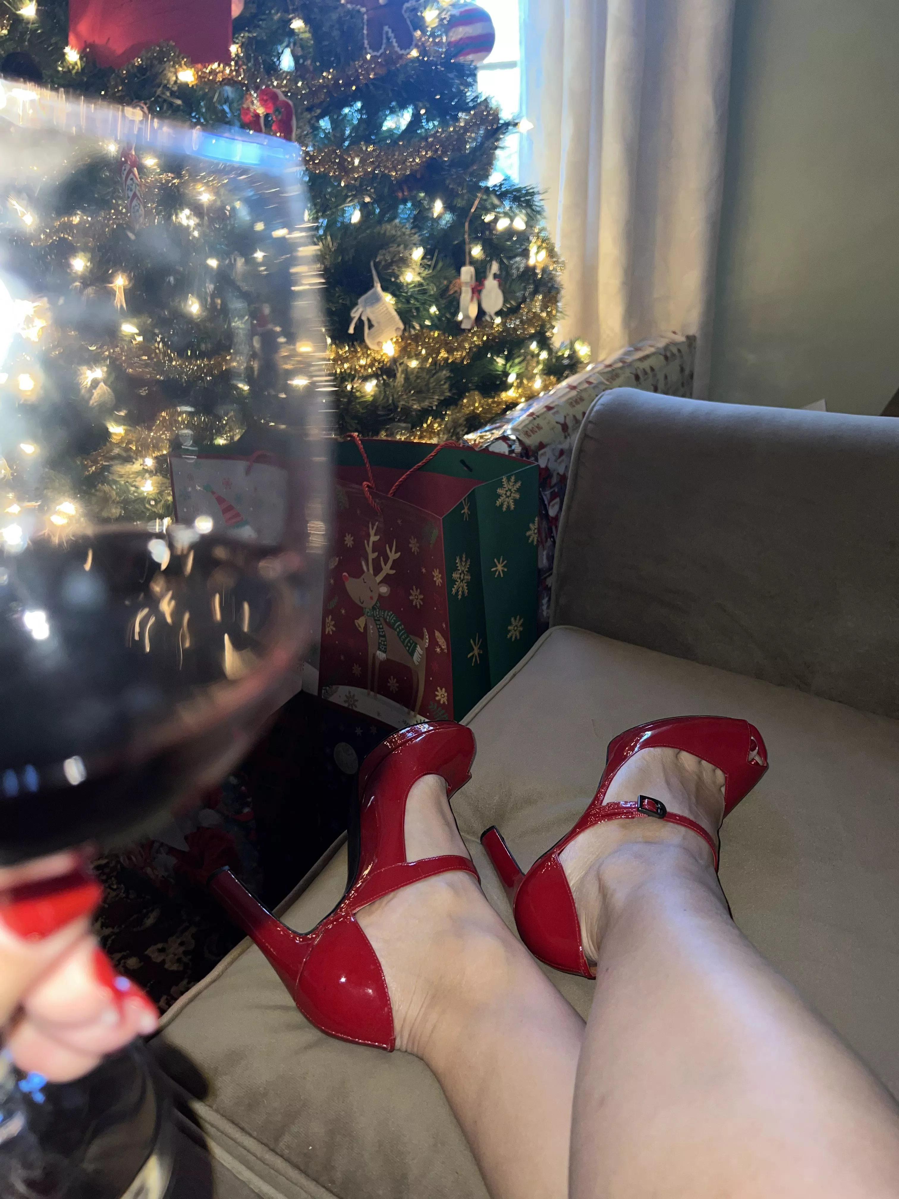 Red wine, red heels, red nail polish and lipstick