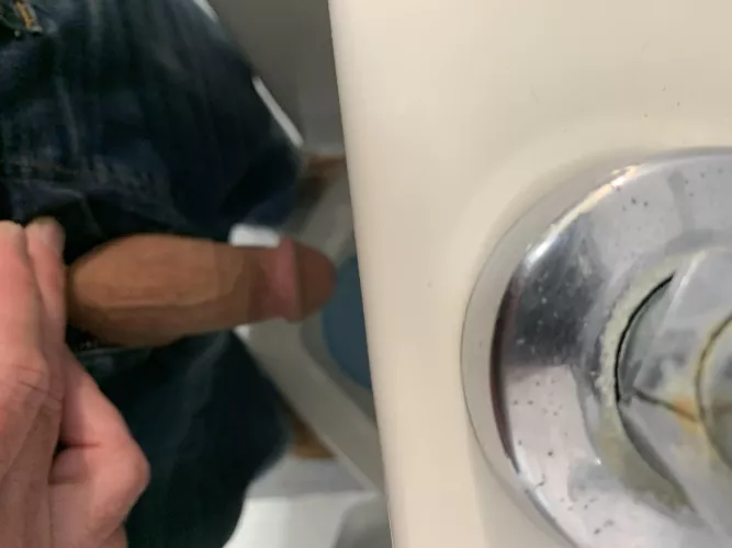 At a Urinal in a men's room (66M)