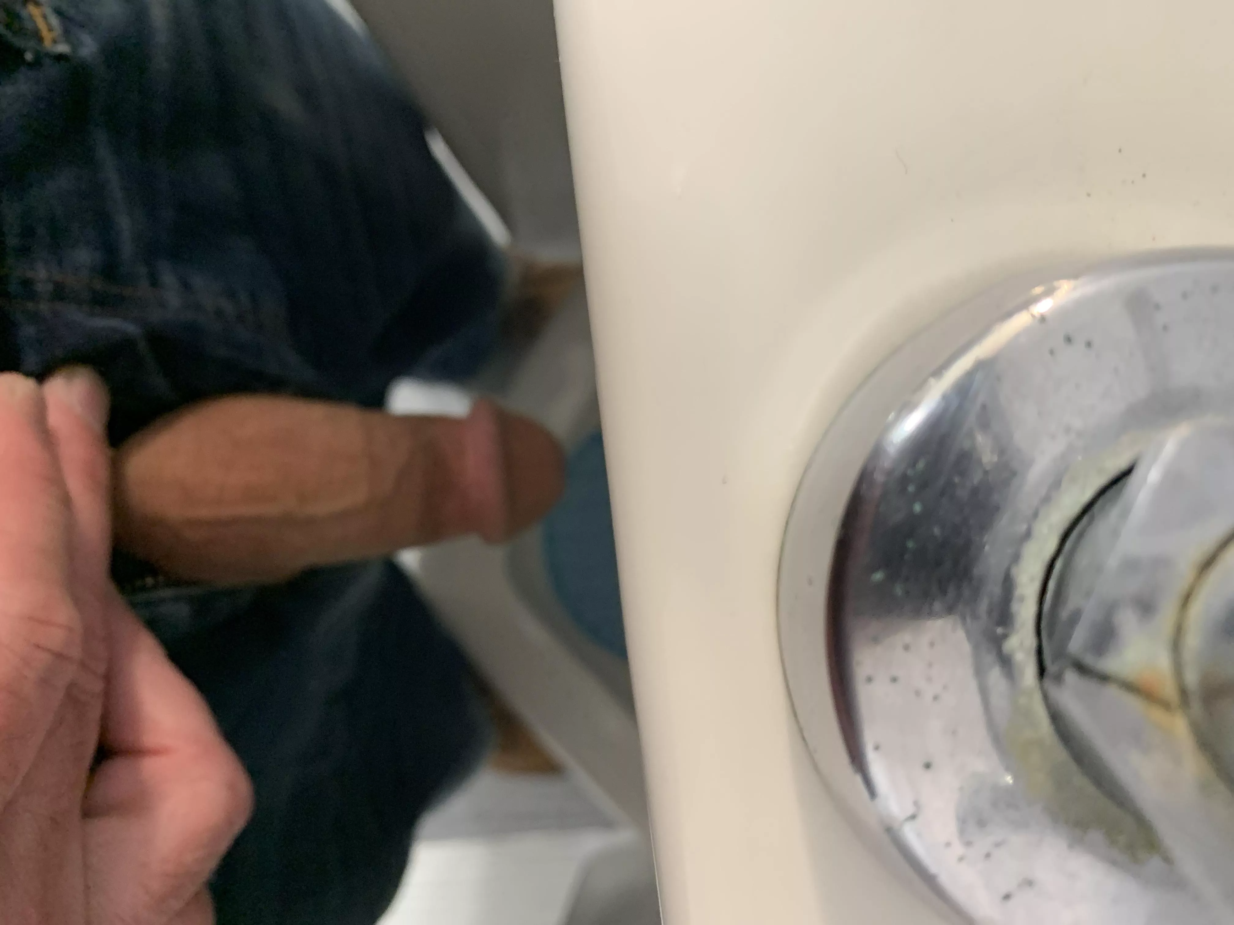 At a Urinal in a men's room (66M)