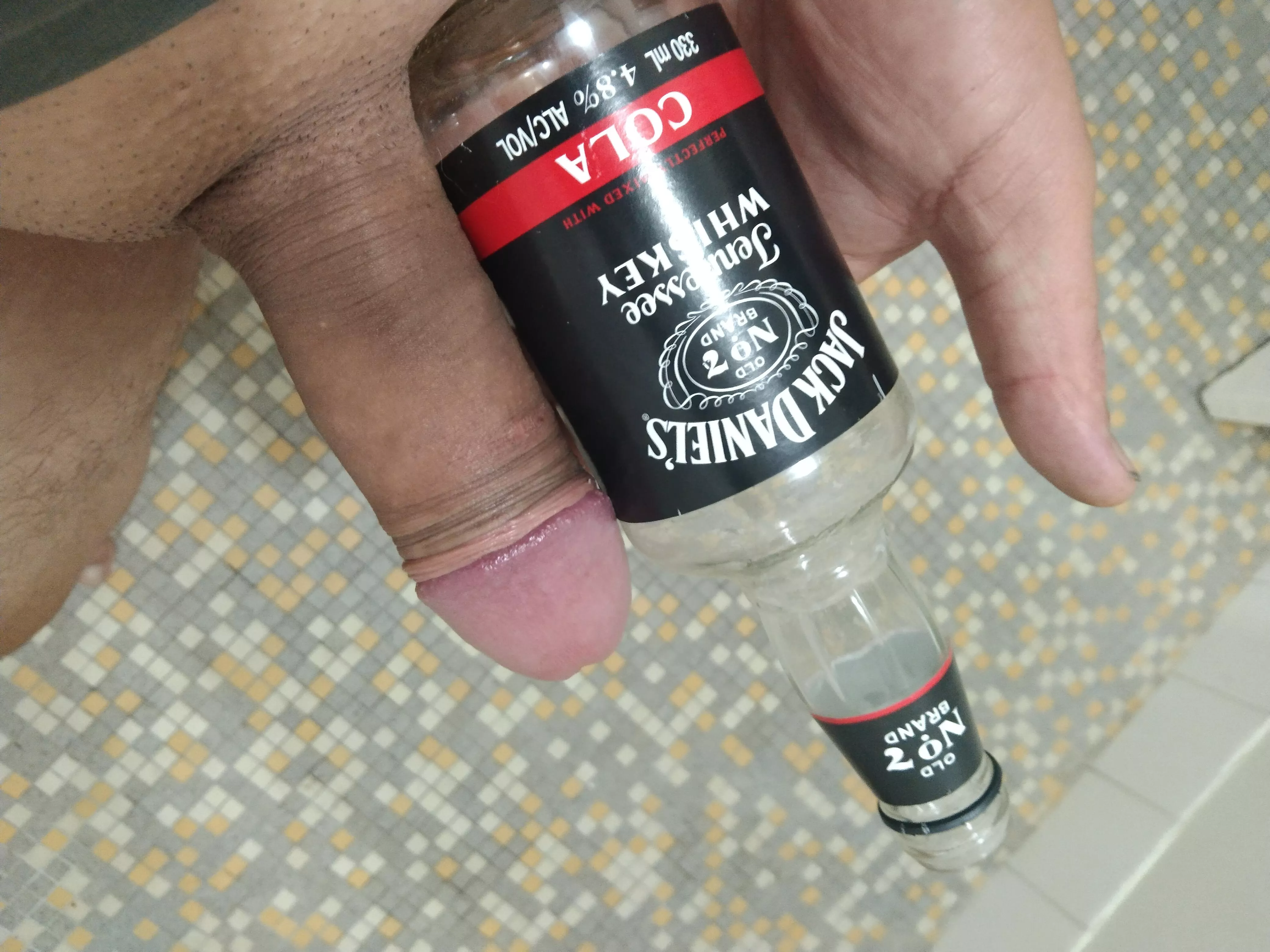 Comparing my cock with JD bottle