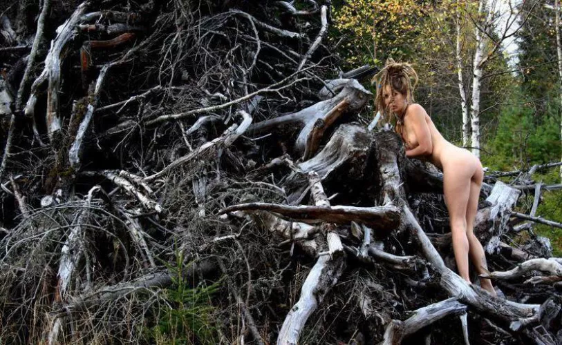 Leona, dreadlocked hippie chick exploring a clear cut!