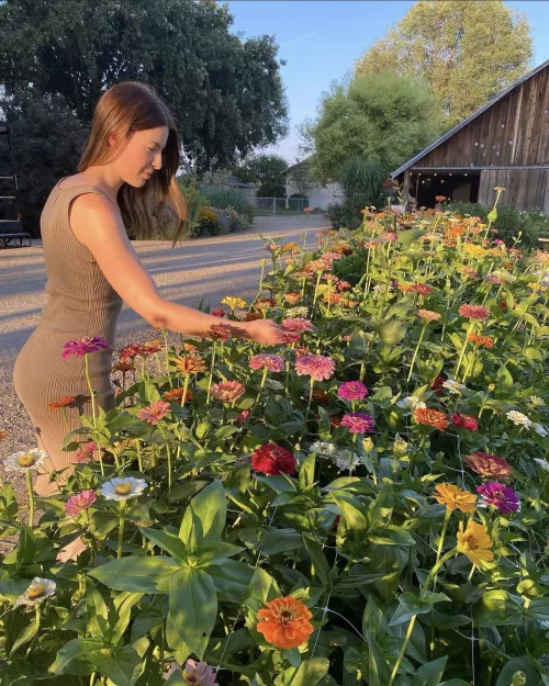 brunette smelling the flowers