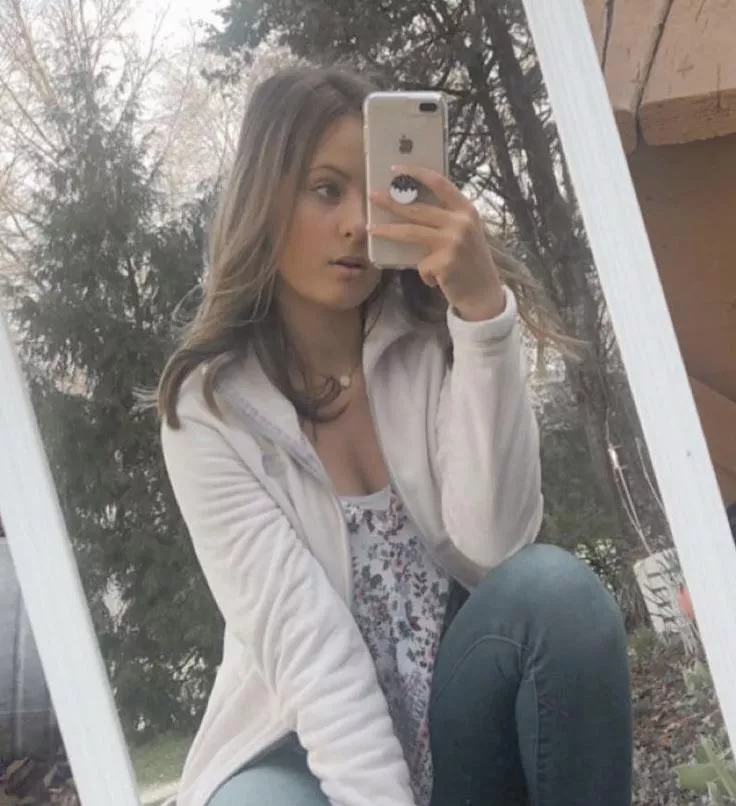 Pretty girl looking at something on her phone.