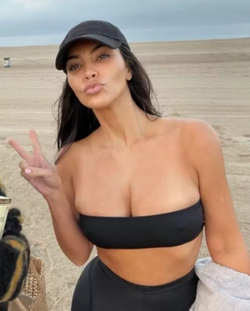 The only thing that is protecting her massive tits from falling is a small strip of cloth