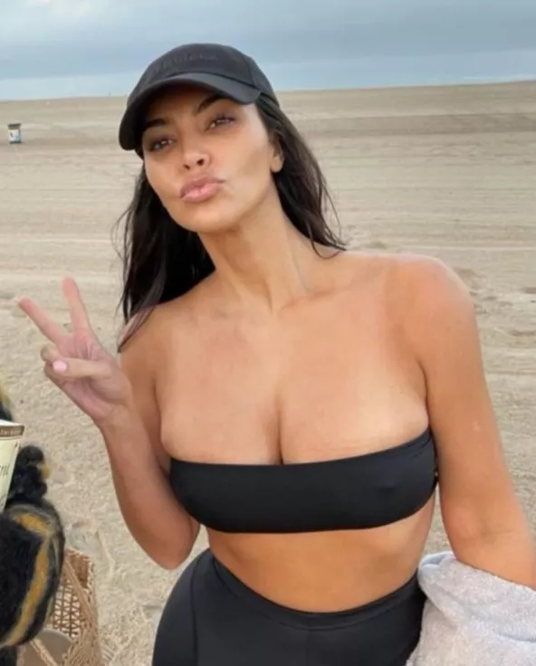 The only thing that is protecting her massive tits from falling is a small strip of cloth