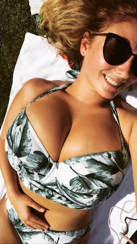 Huge tits bursting out her bikini