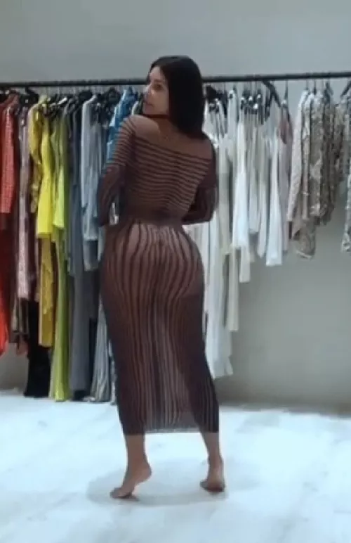 Kim flexing her great ass while wearing see through