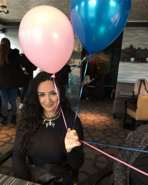 The balloons in her hand are not the only big things