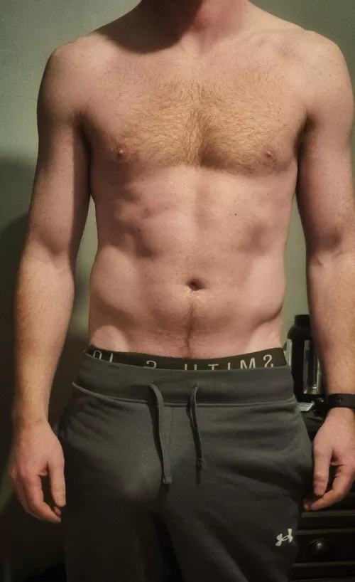 Bulging in grey sweatpants