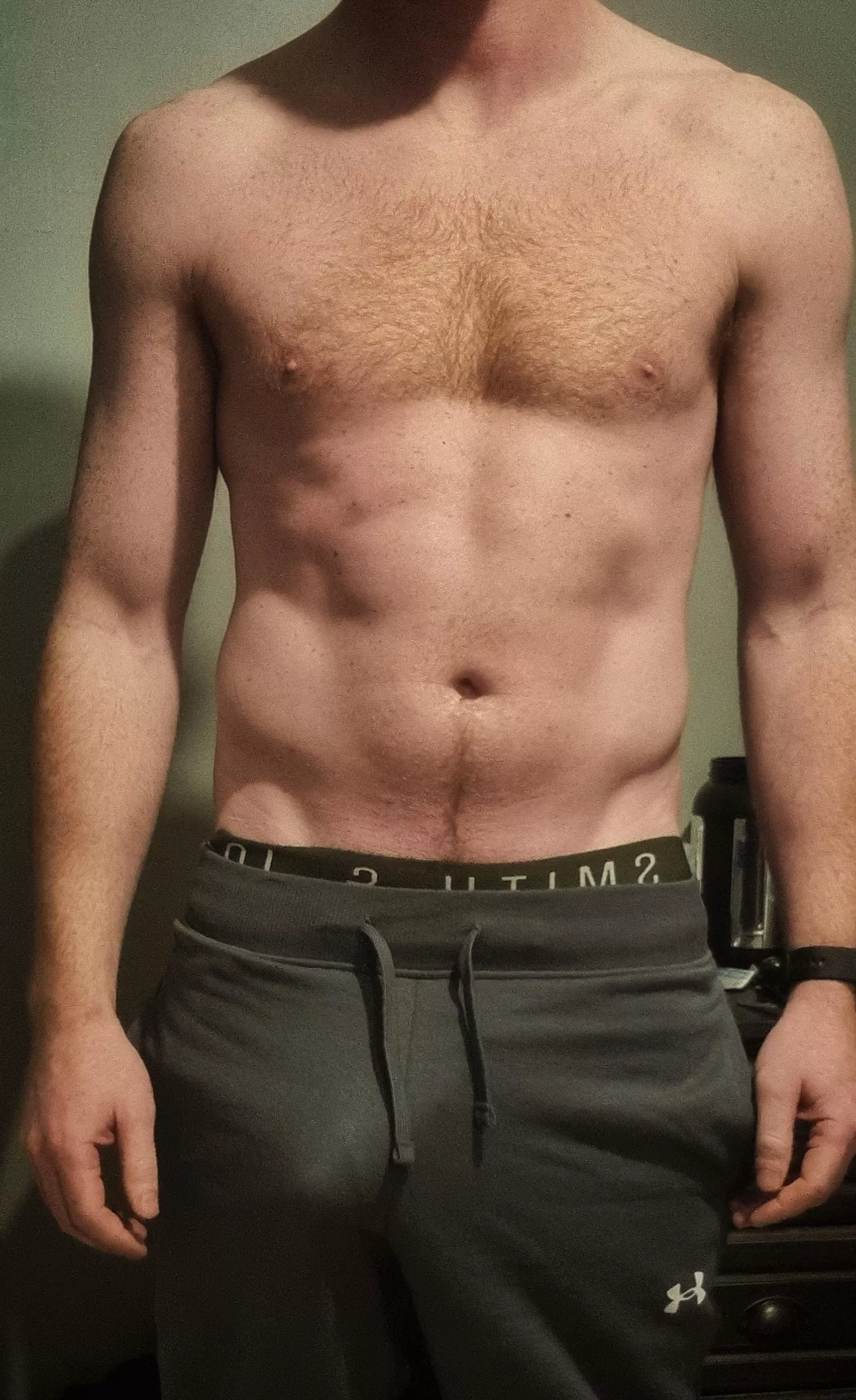 Bulging in grey sweatpants