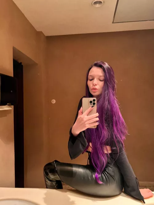 Leather pants, shiny boots and purple hair... Smash or pass?