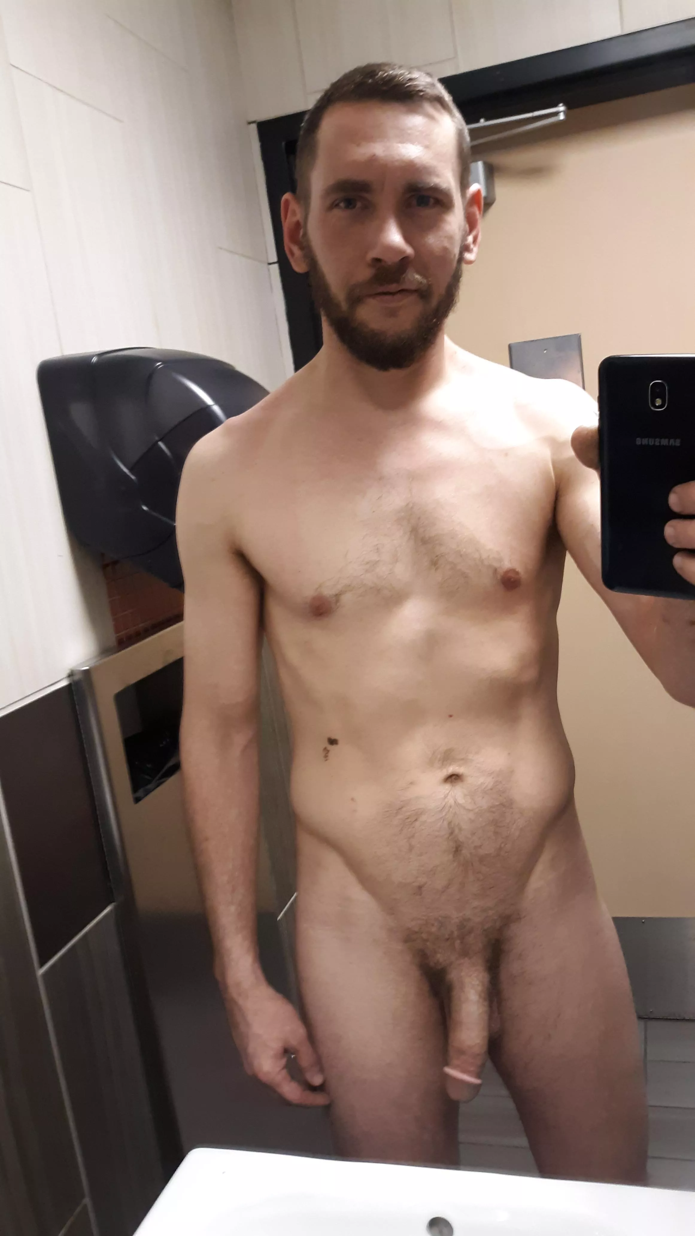 Naked in the men's room at a movie theater.
