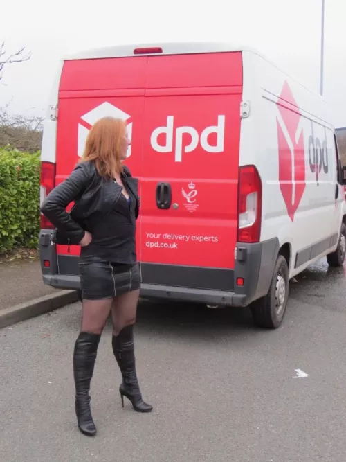 Redhead, Leather, stockings, boots on the street beside a DPD van - what could be better?