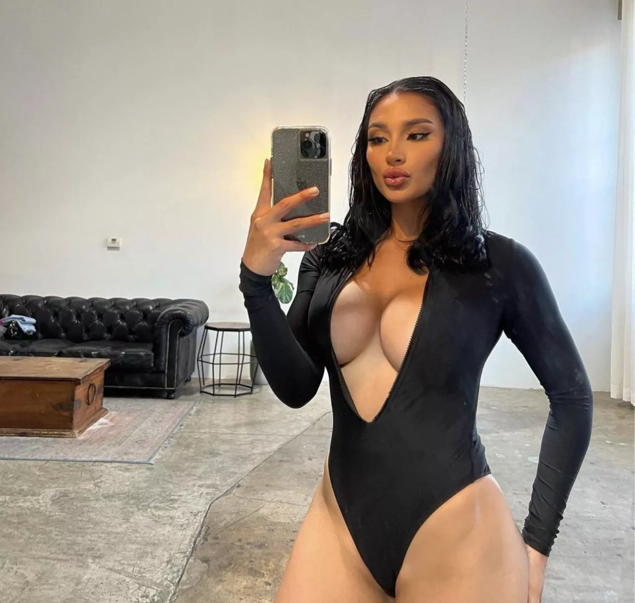 Exposing her cleavage