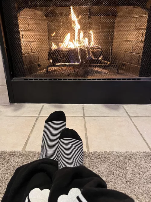 Keeping warm by the fire