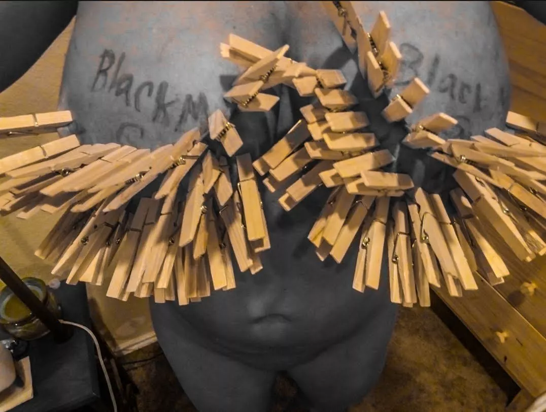 25 clothespins on each breast total 50