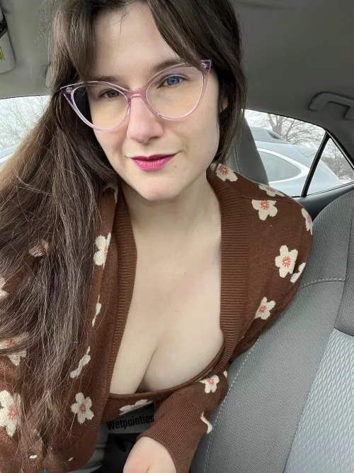 Reaching over to unlock the door for you.