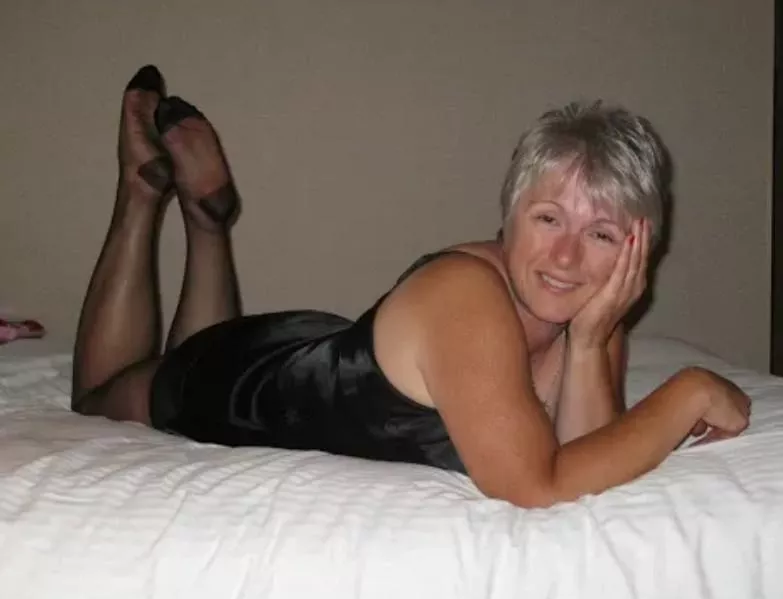 Silver haired mature in black