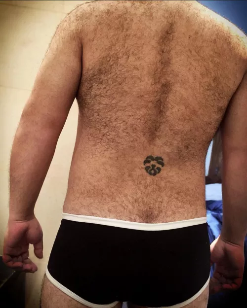 [35] Meet the lion tattoo on dad’s hairy back.
