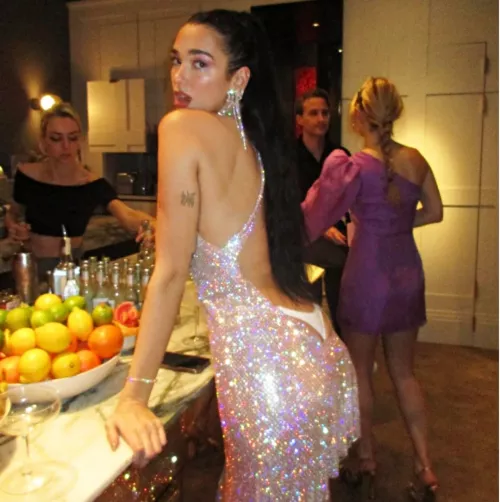 Dua Lipa in a backless dress.