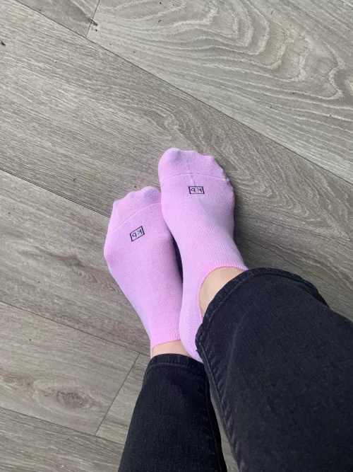 Little pink socks, and a hint of blue toe nails.