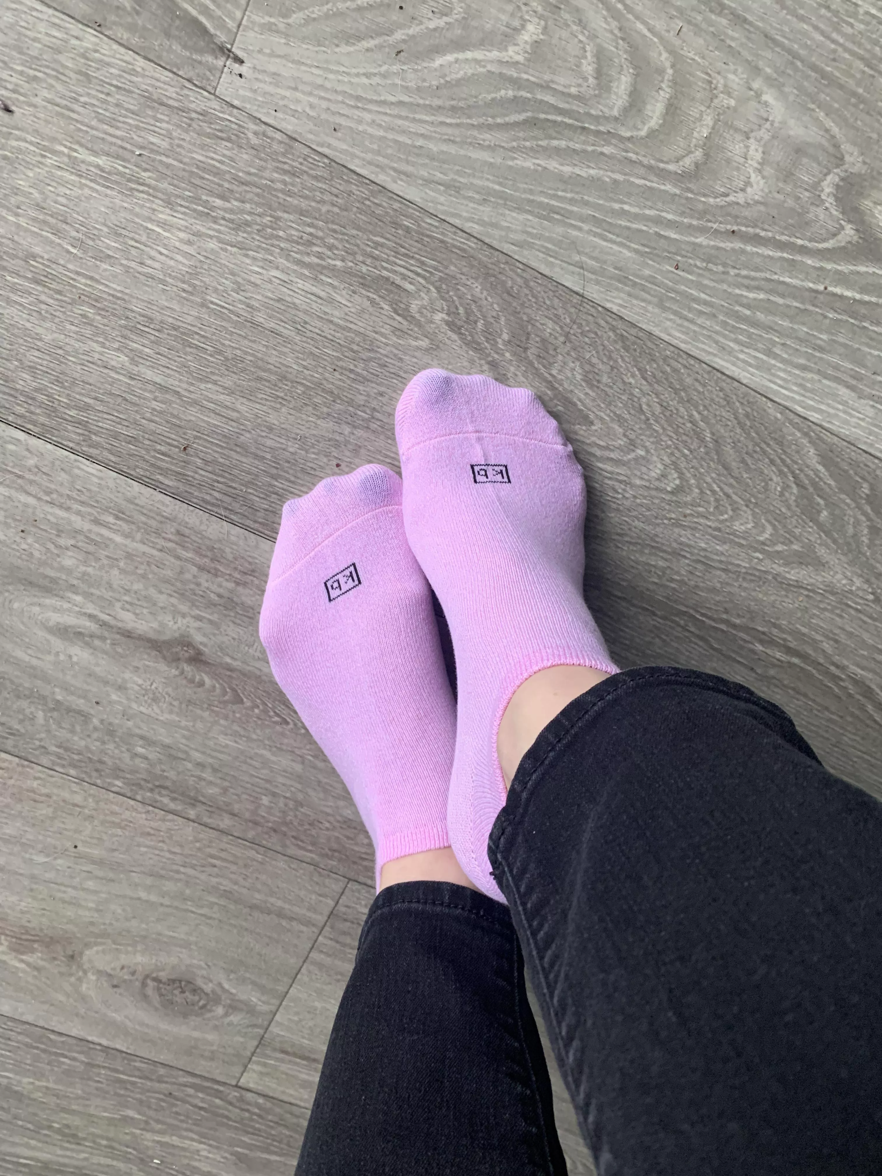 Little pink socks, and a hint of blue toe nails.