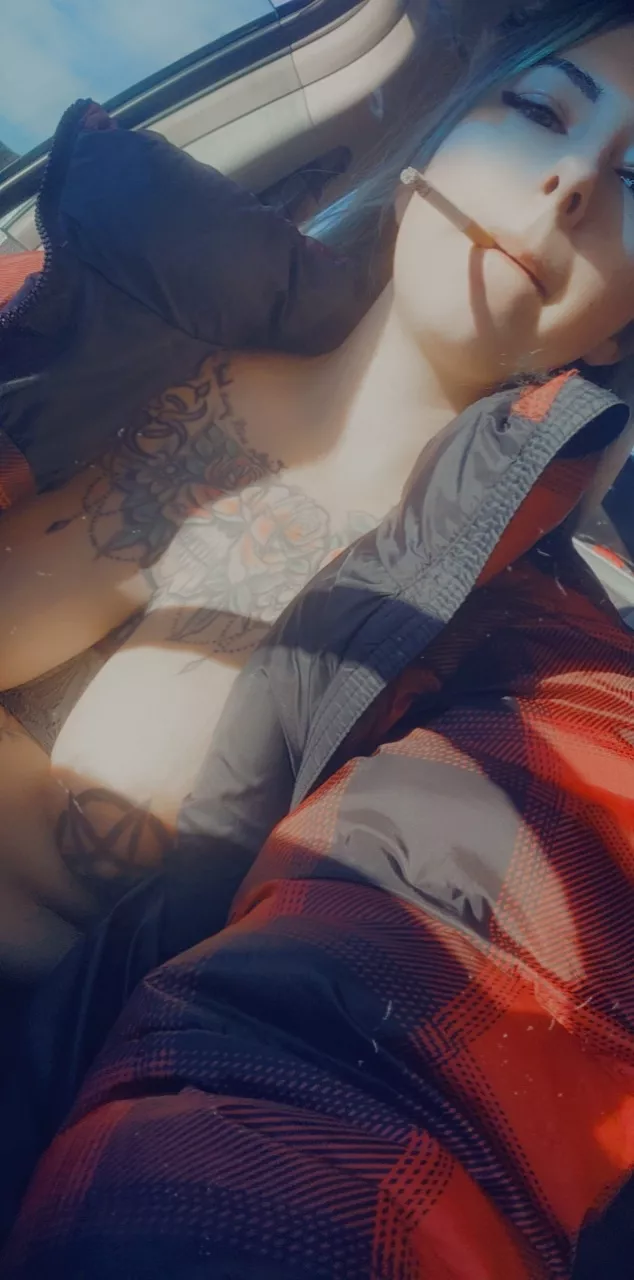 just a quick snap of me smoking in the car.. oh ya I didn't feel like wearing a shirt :P