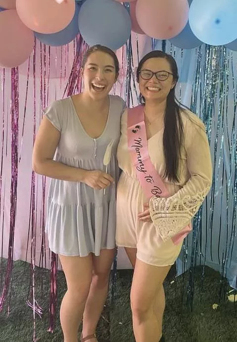 Asian girl with her pregnant sister