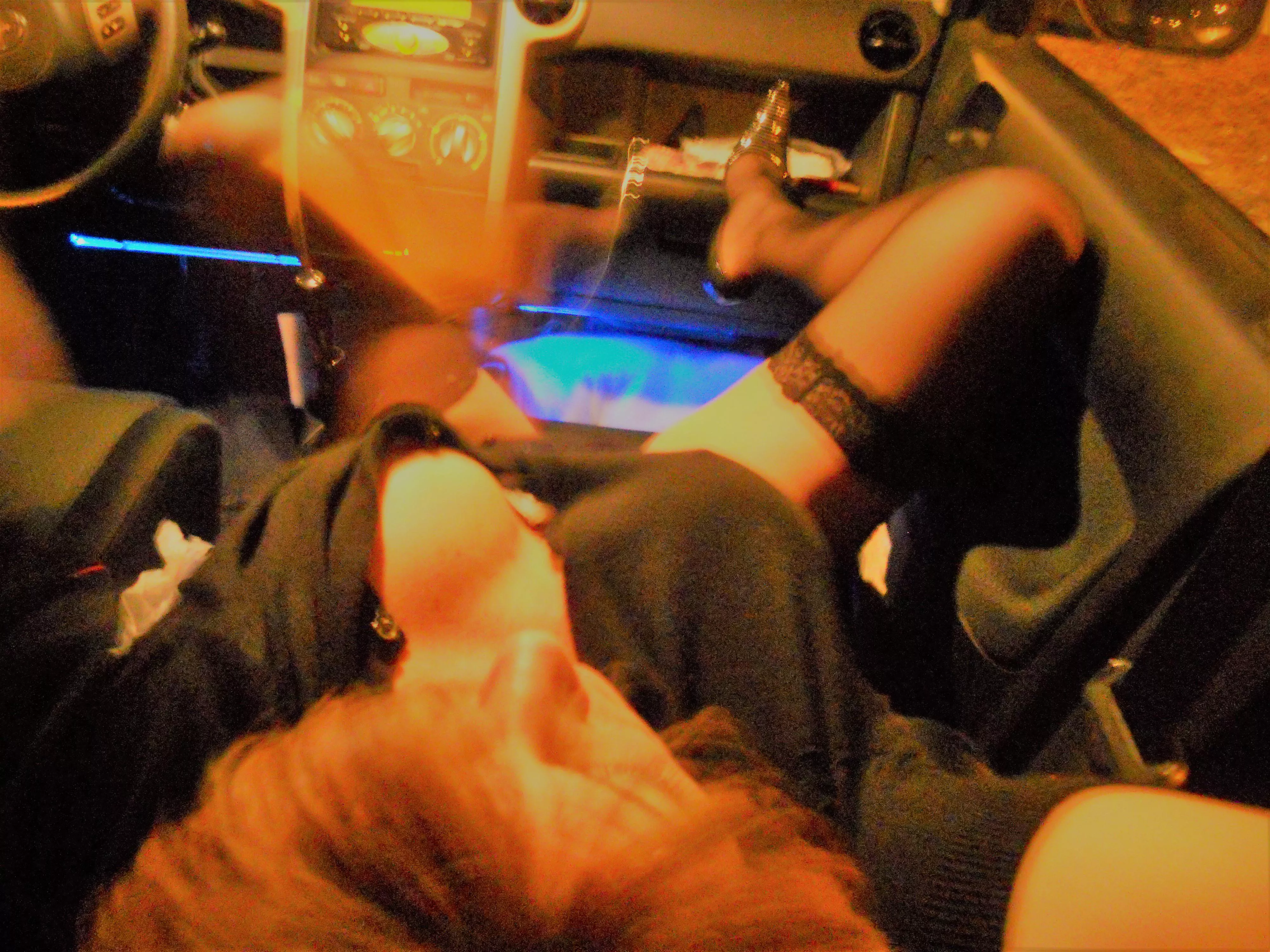 I could feel him leaning over the back seat, peering down at me