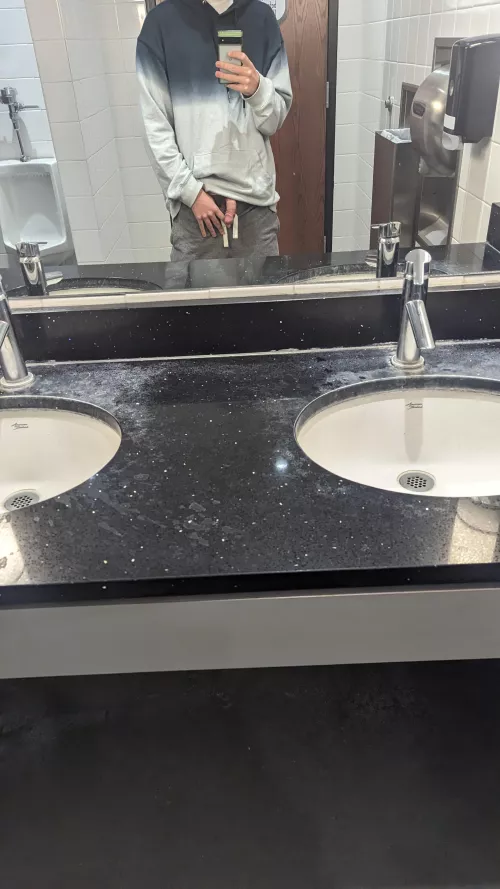 Showing off in grocery store bathroom