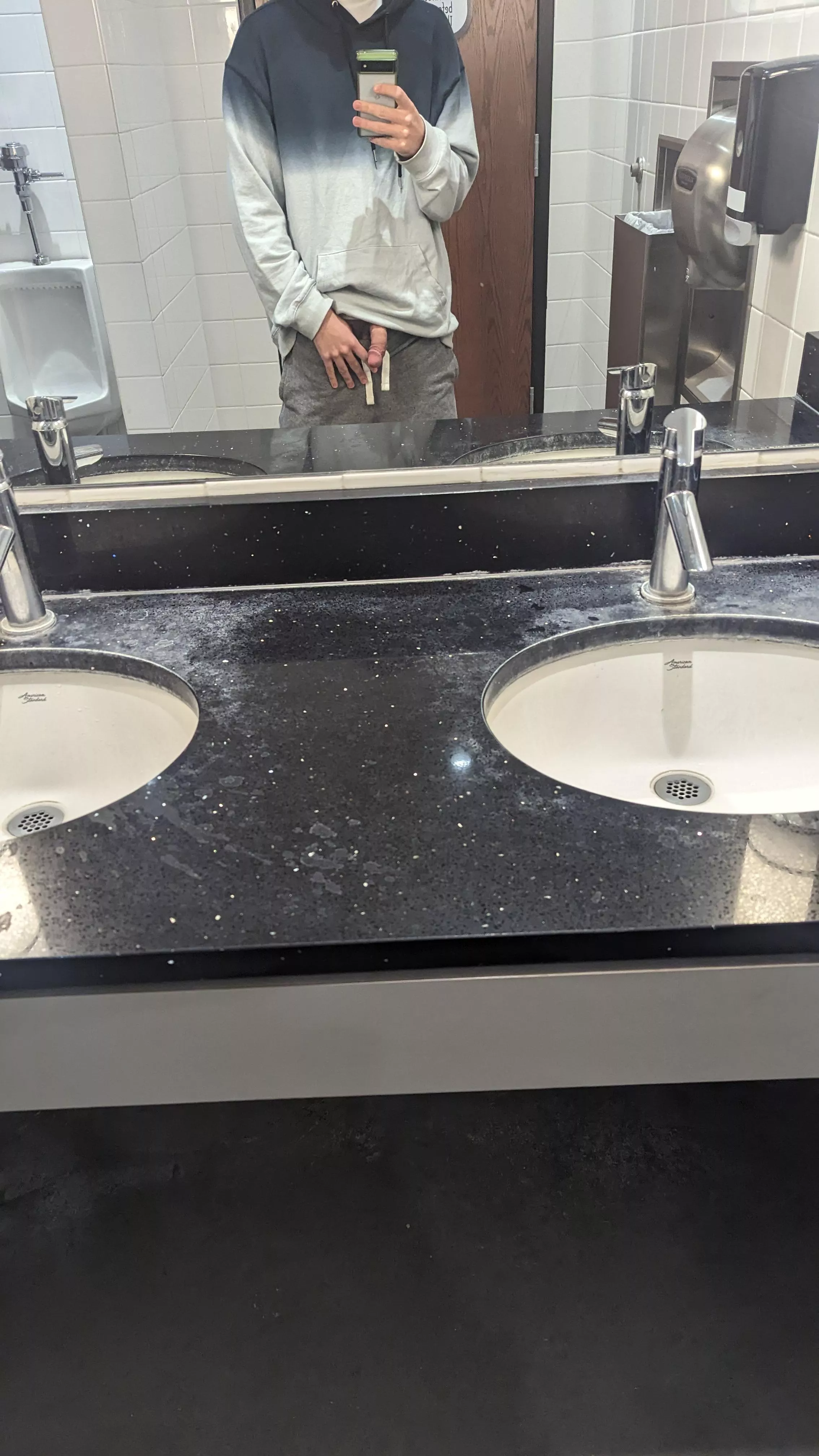 Showing off in grocery store bathroom