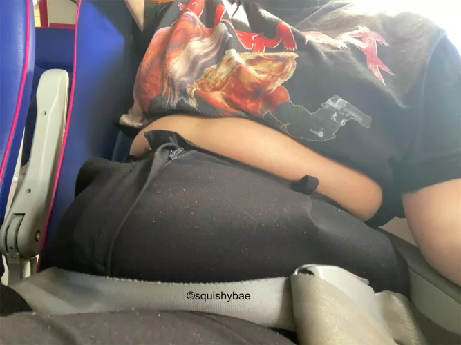 On the flight to my all inclusive holiday but I’m already hanging out of my pants? Also note the sugar on my pants from my snacks 🤭