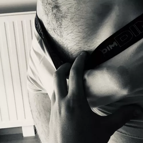 Teasing him through his underwear