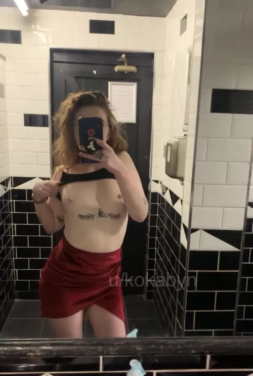 Flashing in a red velvet skirt