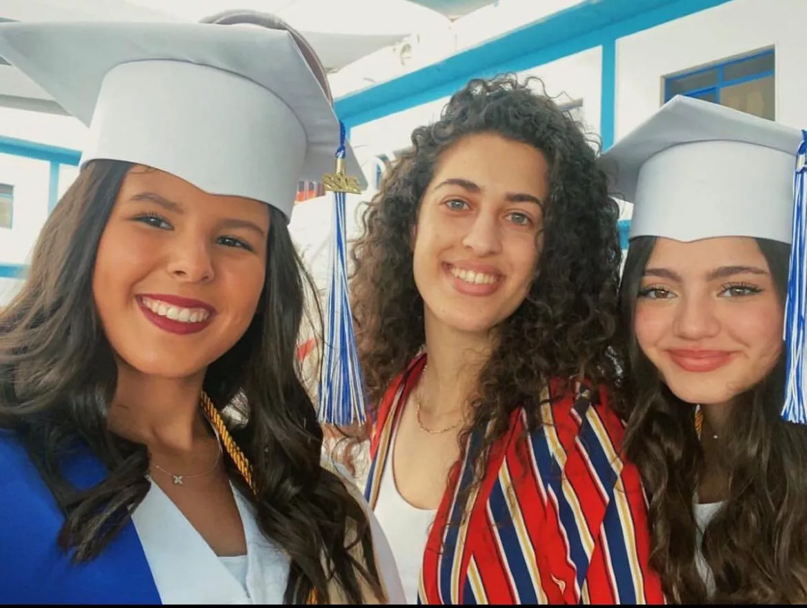 Teacher with her 18 year old graduates