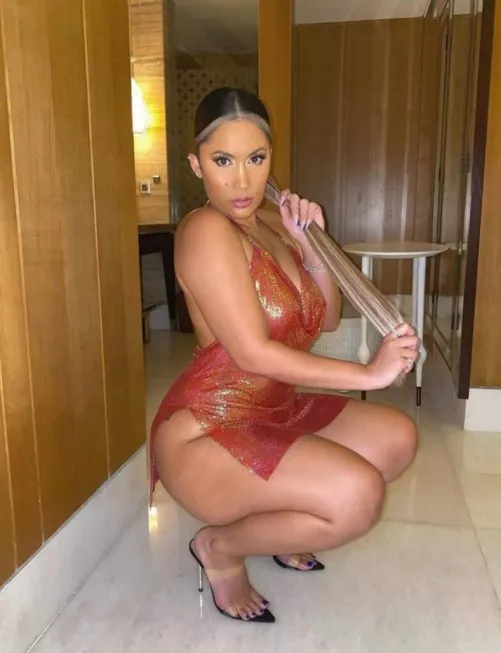 Curvy brunette barely dressed