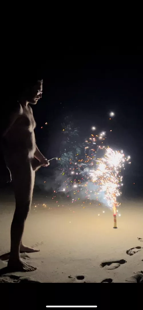 Spraying in front of New Years fireworks